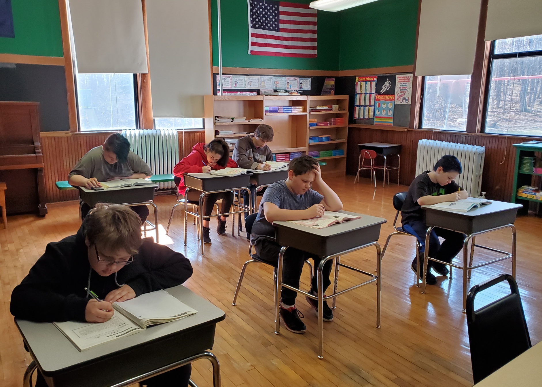 Students studying at their desks in the classroom