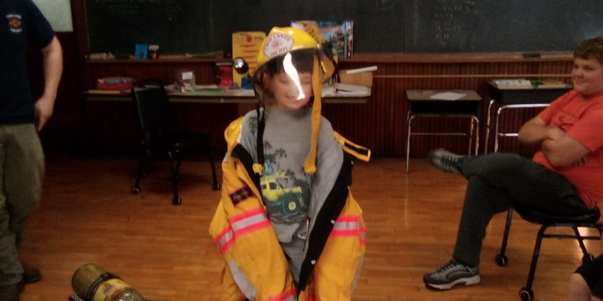 Justin wearing some fire gear.