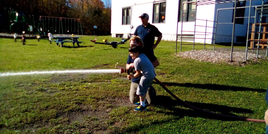 Justin working the fire hose nozzle.