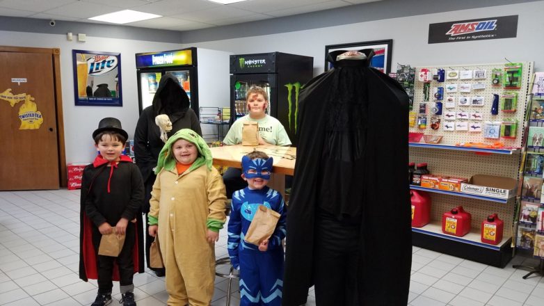 Ms. J., Olivia, Oliver, Reggie, and Mr. Greg costumes at 4 seasons store.