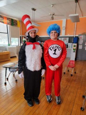 Mr. Greg (cat in the hat and Reggie (thing 1) side by side.