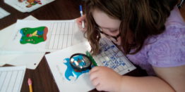 Olivia working on word search find activity.