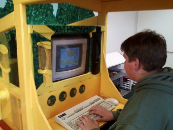 Reggie playing on computer at the Children's Museum.