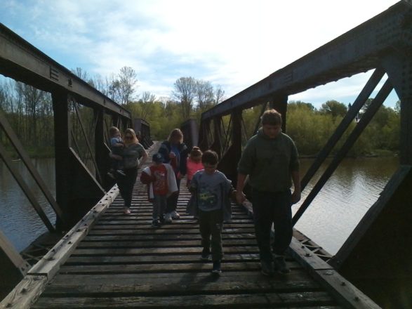 kids walking on the Ontonagon train bridge.
