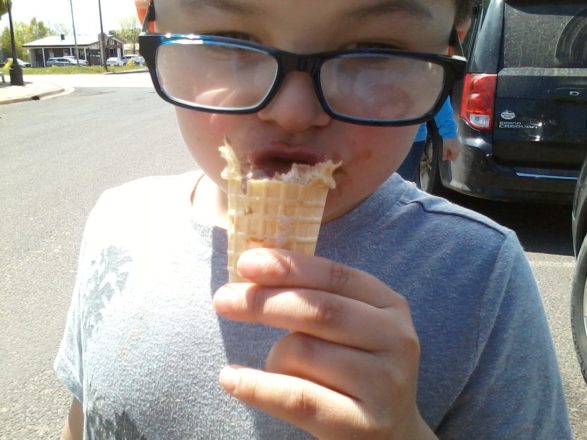 Justin eating ice cream cone.