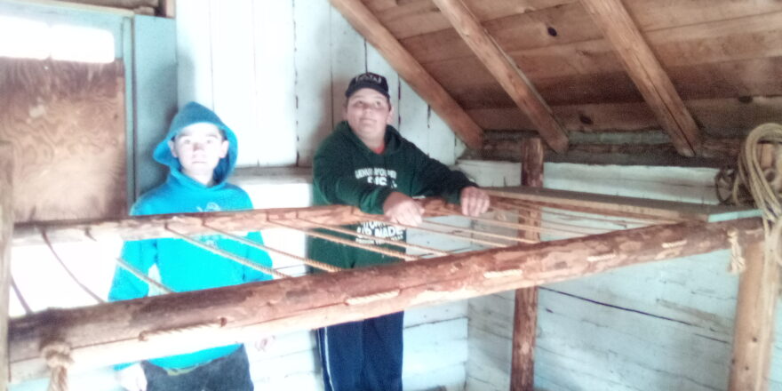 Jacob and Reggie in top loft of cabin #7 at Old Victoria.