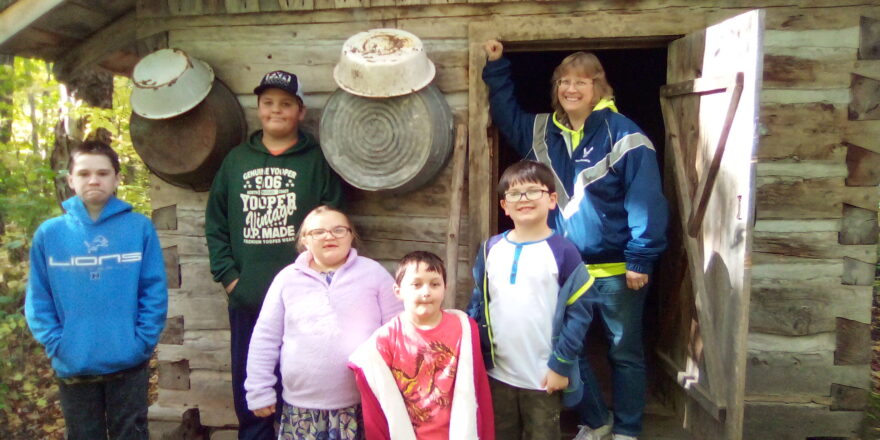 Jacob, Reggie, Olivia, Justin, and Ms. J. standing outside the Old Victoria sauna entrance.