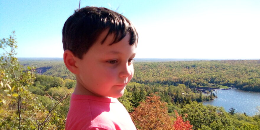 Oliver standing on the rock at Lookout Mountain.