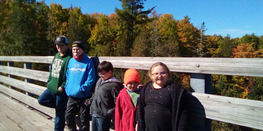 Reggie, Jacob, Justin, Oliver, and Olivia posing for a pic on the trestle bridge.