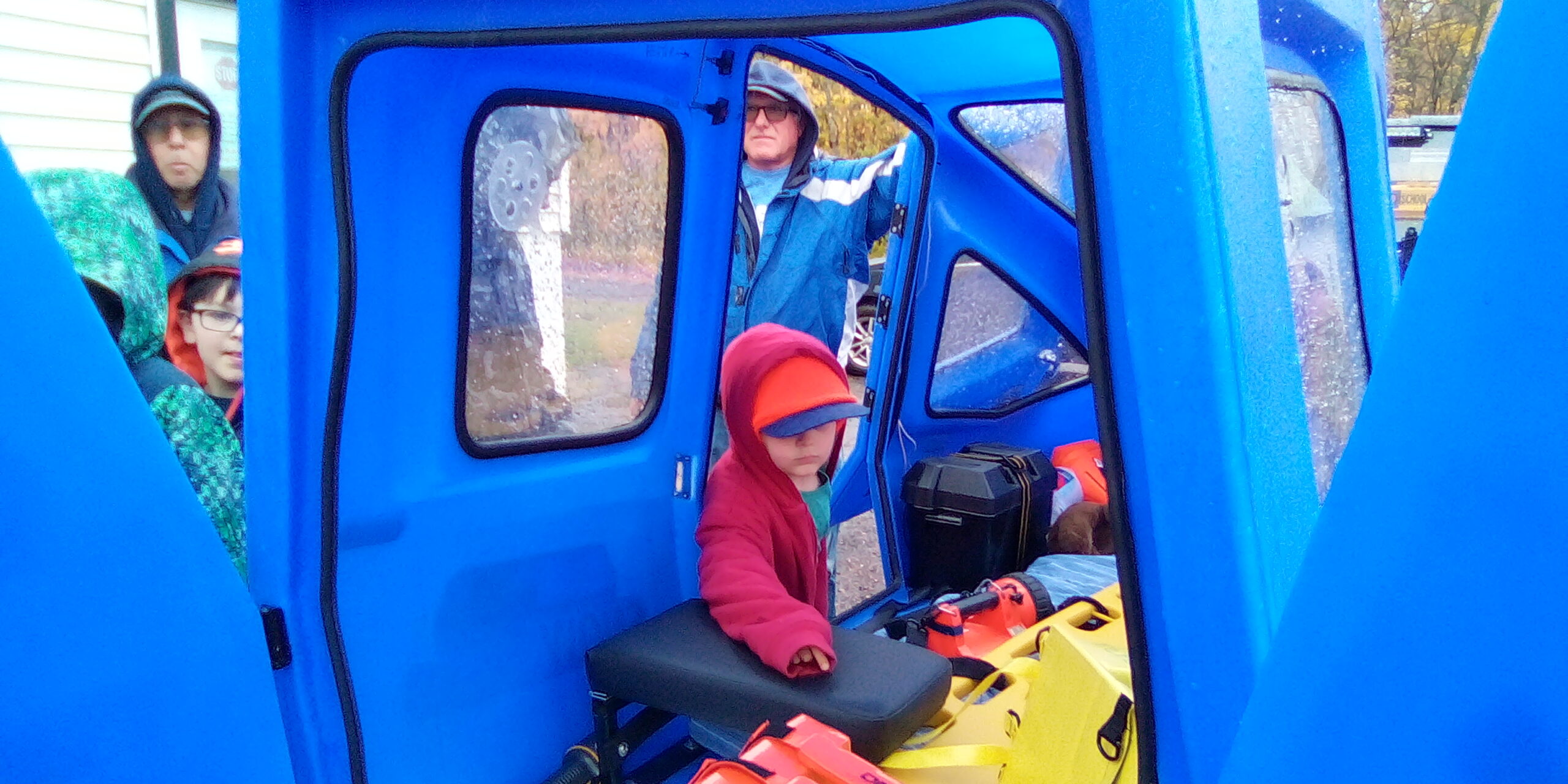 Oliver looking inside the rescue sled.