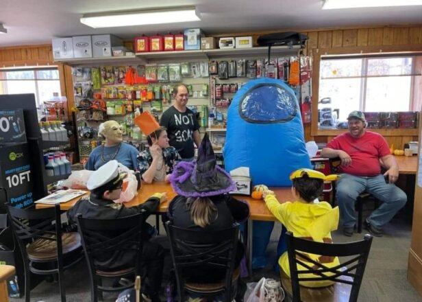 Halloween 2022 trick or treating at Krupps. Reggie, in his old man mask. Jacob, Mr. Greg in a NOT SCARY black shirt, Avery wearing his blow up blue Minecraft outfit. and sitting in the front are Justin, in his ship captain costume, Olivia is a witch, and Oliver in his yellow costume.