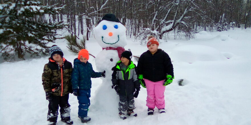 kids build a snow friend at the school.