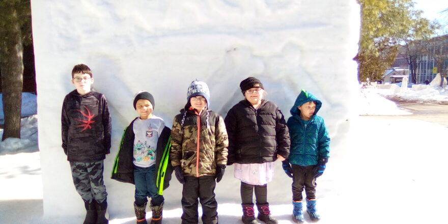 Kids on field trip to MTU snow sculptures.