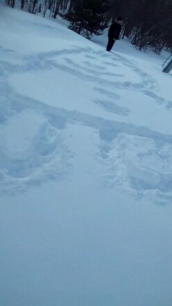 A snow character drawn in the snow using our feet. The snow character is about 20 ft tall and about 15 feet wide.