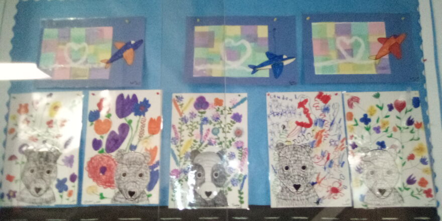 art projects with airplane and smoke trail in shape of a heart on a water color back ground. Then they made spring flowered back ground for their bear they shaded in with different thicknesses of lines.