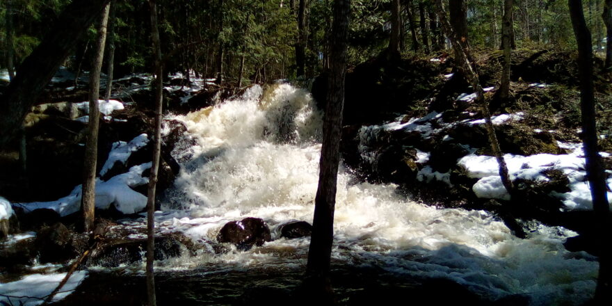 Early spring Wyandotte water fall picture from the bottom side with fast flowing rapids.