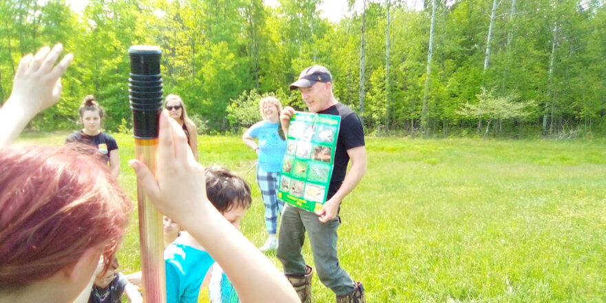 MTU environmental class for Arvon and Elm River school kids at a pond to find what lives in wet lands.