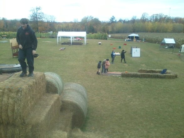 On top of the round bales looking over the Palosaari Corn Maze area.