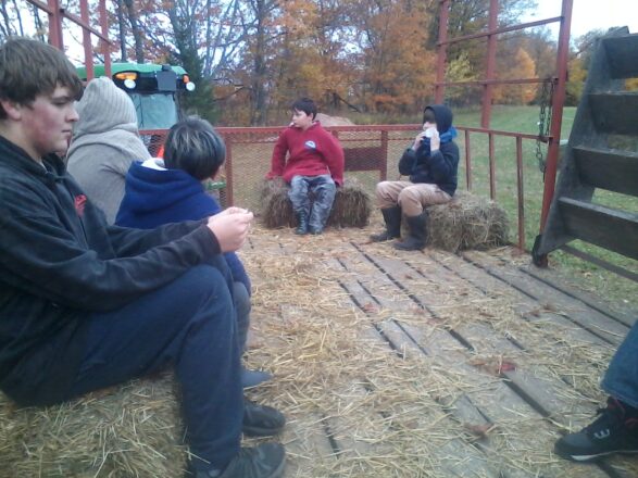 The students were taken for a hay wagon ride around the corn maze property.