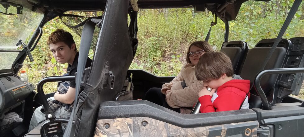 Some of our students sitting in the side by sides waiting to go back to the school.