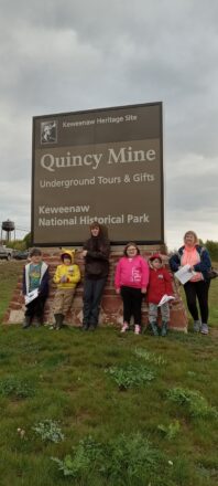 Students gathered under the Quincy Mine sign out front before going to explore the area.