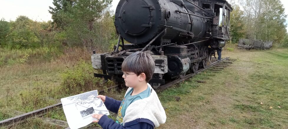 A student looking at our site map to show us where we are.
