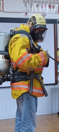 Mr. Greg put on the full gear to feel what it's like to wear a fire fighter's suit.