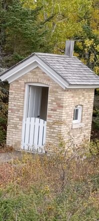 The well built brick out house or "privy" was a three person unit for two adults and one child to use.