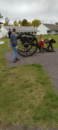 Checking out the cannon in front of the Fort Wilkins settlement.