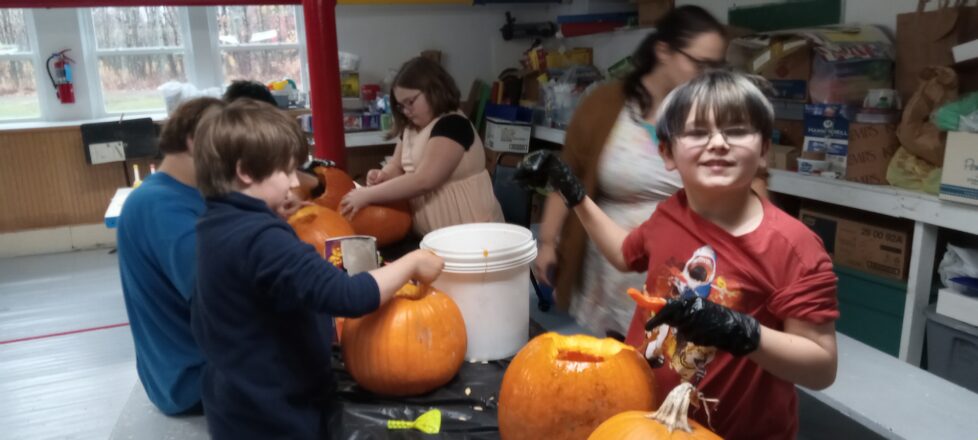 All the kids are working on cleaning out their pumpkin inners to get ready for carving.