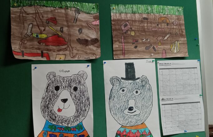 Art projects displayed on board. Bears wearing sweaters with facial hair using short line shading techniques done by sharpies. The top two are underground scenes that show items you would bury for someone to find in the future. The top of each dirt picture has grass growing on top.